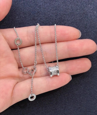 Bvlgari Silver Spiral Circle Pendant Necklace – Elegant Luxury Jewelry
