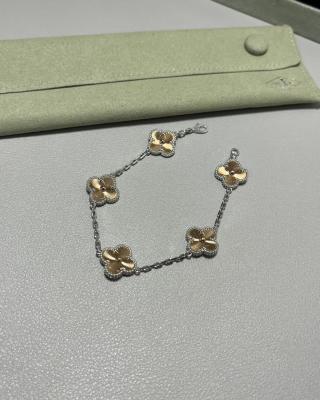 Van Cleef & Arpels Alhambra 5-motif bracelet featuring laser-engraved and mixed-color clover motifs.