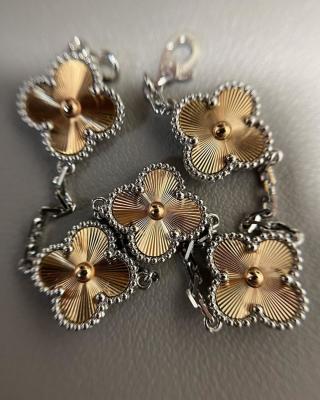 Van Cleef & Arpels Alhambra 5-motif bracelet featuring laser-engraved and mixed-color clover motifs.