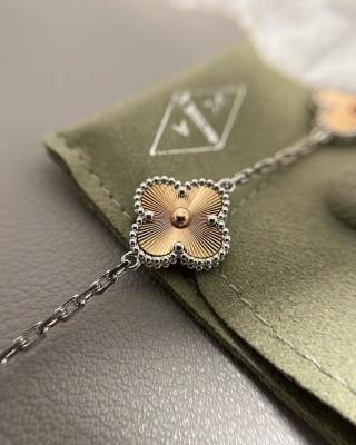 Van Cleef & Arpels Alhambra 5-motif bracelet featuring laser-engraved and mixed-color clover motifs.