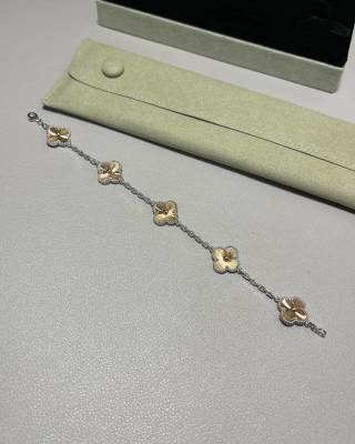 Van Cleef & Arpels Alhambra 5-motif bracelet featuring laser-engraved and mixed-color clover motifs.