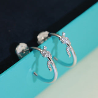 Tiffany Knot Stud Earrings – Polished Finish with Half-Pavé Diamonds