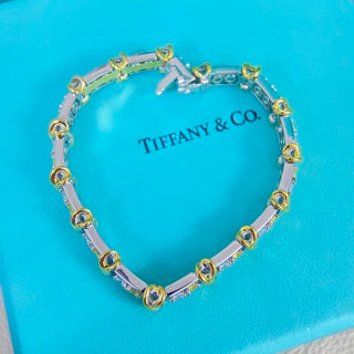 Tiffany & Co. rose gold multi-link flexible bracelet with diamond-set cross motifs