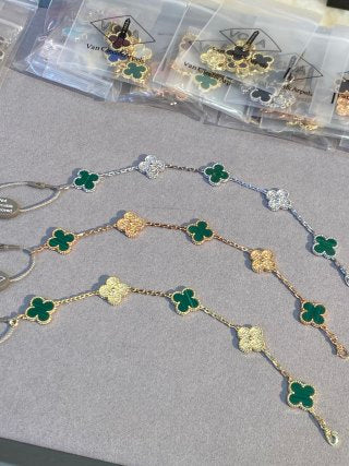 Van Cleef & Arpels Malachite 5-Motif Clover Bracelet with Gold-Tone Details