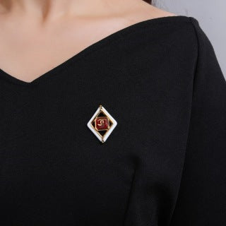 CHANEL Delphine Ruby Diamond Emblem Brooch