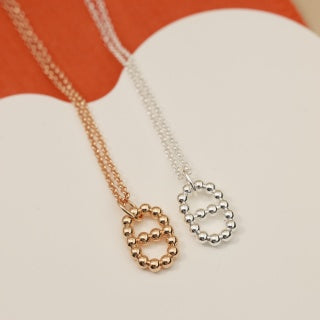 Hermès Beaded Oval Loop Pendant Necklace