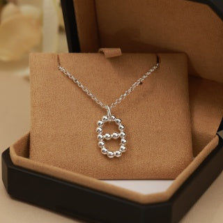 Hermès Beaded Oval Loop Pendant Necklace