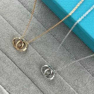 Tiffany & Co. Double-Clasp High-Polish Gold Circle Pendant Necklace with Knife-Edge Detail