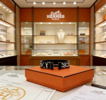 Hermès Black Enamel Signature Hinge Bracelet