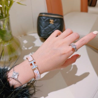 Hermès White Enamel Signature Hinge Bracelet
